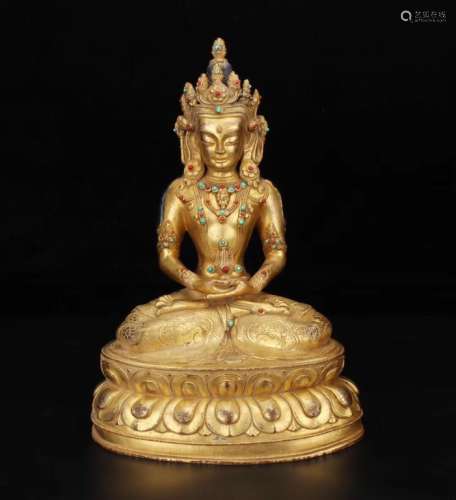 A GILT-BRONZE OF BUDDHA