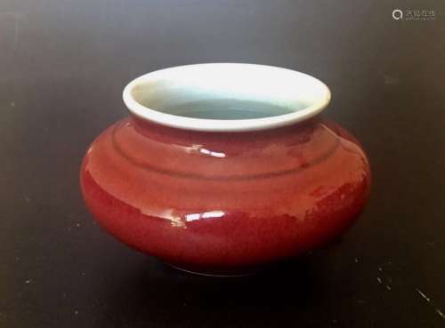 A RED GLAZED WATER COUPE