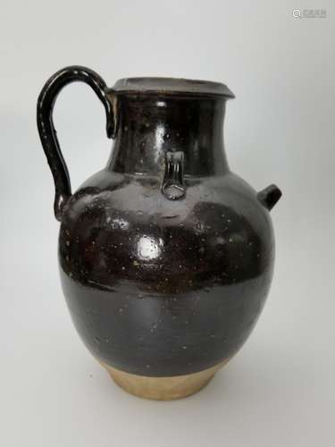 A BLACK GLAZED EWER