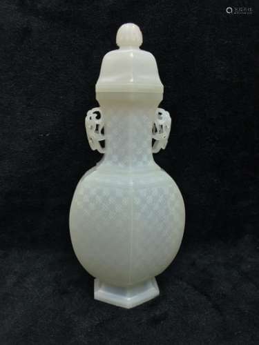 A HETIAN CARVED FACETED VASE AND COVER