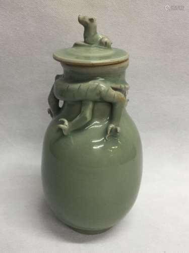 A CELADON VASE AND COVER