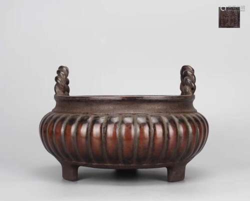 A BRONZE TRIPOD CENSER