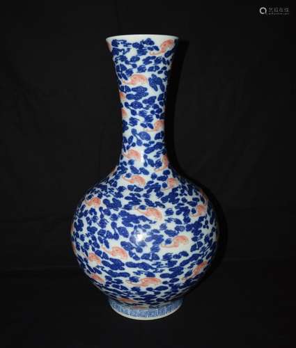 A COPPER-RED AND UNDERGLAZE BLUE BOTTE VASE