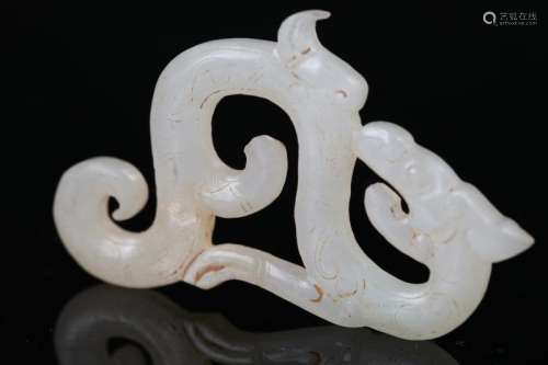 A Carved White Jade Dragon Pendant