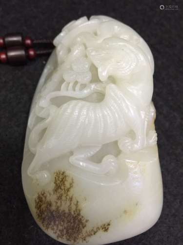 A Carved Jade Pendant