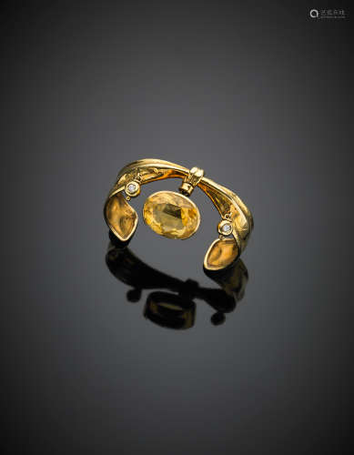 MISANIYellow gold bangle with an oval citrine quartz and two diamond charms, g 27.00, diam. cm 5.4. Signed MISANI