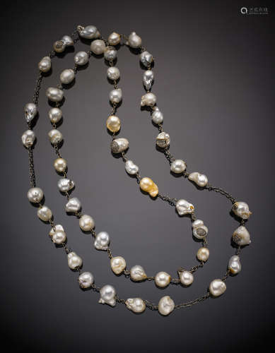 Long baroque South Sea baroque pearl necklace, each pearl with black gold and diamond set inlays and chain spacers, g 299, length cm 170 circa. (defects and losses)
