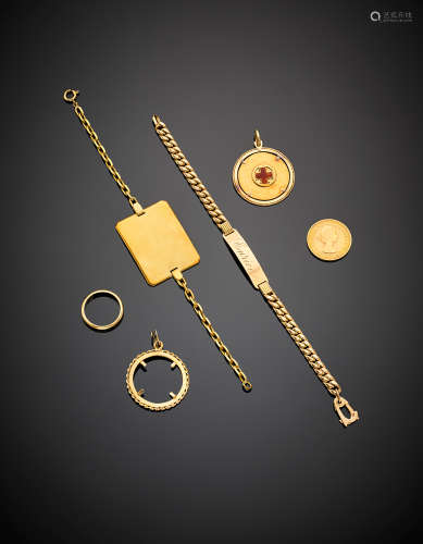 Yellow gold lot composed of two bracelets, a wedding ring and two charms, in all g 52.08. (defects)