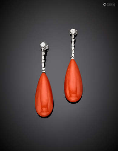 White gold round and baguette diamond pendant earrings suspending two red orange coral drops of cm 4.3 each circa, g 28.60, length cm 7.5 circa.