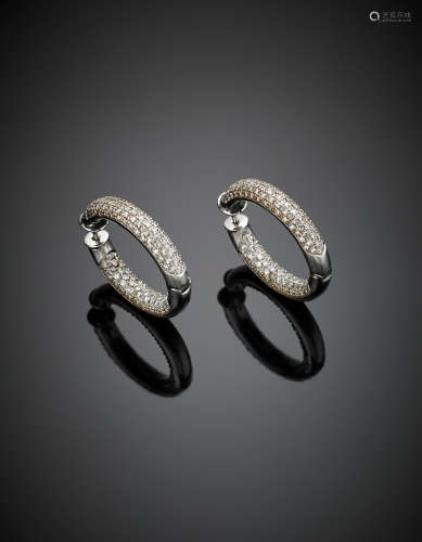 A pair of hoop white gold and diamond-set earrings g 22.80, diam. cm 3.20.