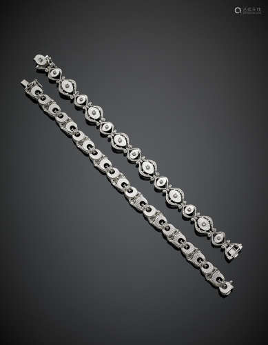 Two white gold modular bracelet accented with diamonds, in all g 49.80, length cm 19 circa. One marked UNOAERRE