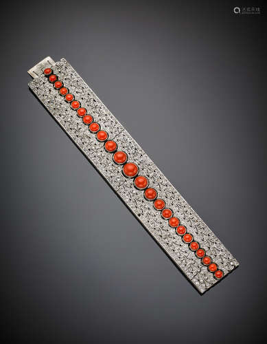 White gold, round colourless stone, round cabochon graduated red coral openwork band bracelet, g 81.94, length  cm 19, width cm 3.40 circa.