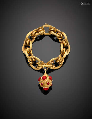 Yellow gold chain bracelet with red coral accented charm, g 69.19, length cm 21.50 circa.