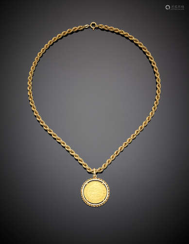 Yellow gold twisted rope necklace with Arab coin pendant, g 22.10, length cm 43.50 circa.