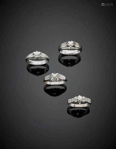 Lot of four white gold diamond gent's rings, different shapes and sizes, in all g 22.70.
