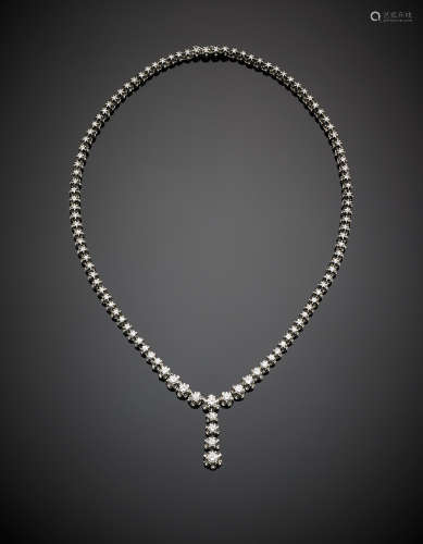 White gold graduated diamond necklace with pendant, in all ct. 6 circa, g 33.70, length cm 42.5 circa.