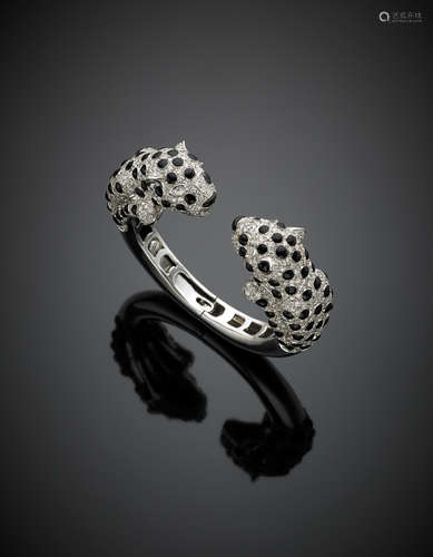 White gold diamond, onyx and black enamel, elastic panther bangle g 91.90, diam. cm 5.7.