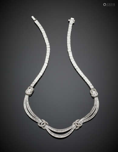 Platinum round and baguette diamond festoon necklace,  diamonds in all ct.18 circa, g 95.80, length cm 47 circa.