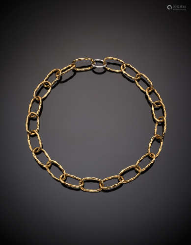 Wrought pink gold ring-necklace with white gold clasp, g 38.20, length cm 55.50 circa.