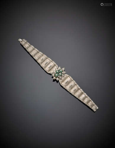 White chiselled gold, diamond and emerald bracelet with flower central, g 48.19, length cm 18.30, h cm 3.20 circa.