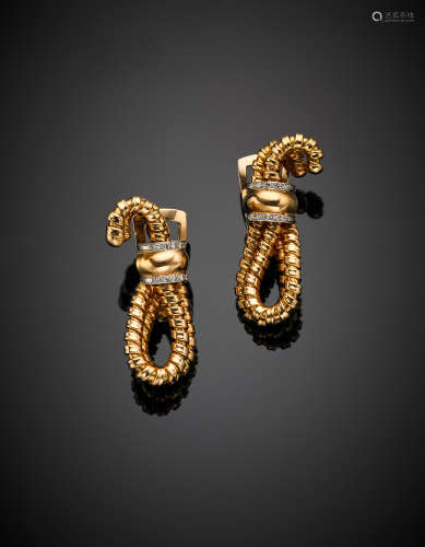 Yellow gold tubogas earrings, white gold and diamond details, g 25.57, length cm 4 circa.