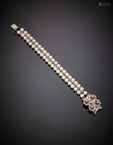 Two strand cultured pearl white gold bound bracelet accented with diamond and rubies, g 47.38, diam. cm 21. In Gobbi case