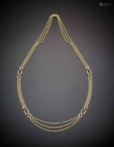 Long yellow gold three-strand modular necklace with articulated diamond set buckle spacers, g 114.5, length cm 87.5 circa. Marked 1974 AL