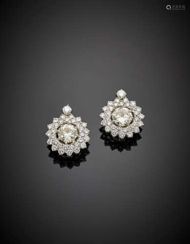 White gold ct. 3.80 and ct. 3.50 circa diamond earrings with diamond surround, in all ct.12.80 circa, g 12.05.