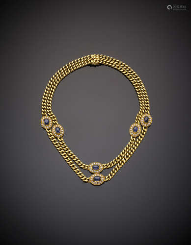 BULGARIYellow gold two-strand groumette chain necklace with cabochon sapphire and diamond spacers, sapphires, in all ct. 8.45 circa, g 81.1, length cm 34.5 circa. Signed BULGARI