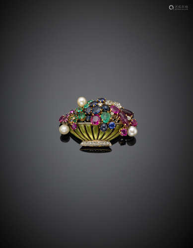 Bi-coloured gold diamond, enamel gem-set flower basket brooch, the partly carved rubies, sapphires and emeralds are of different cuts and shapes, g 11.86, width cm 4 circa.