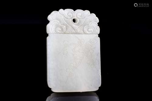 An old white jade pendant with calligraphy