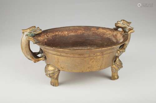 A Chinese bronze dragon-handled tripod censer,