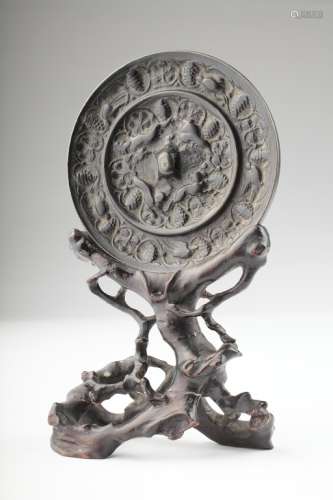 An archaistic bronze mirror,