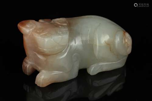 An old Chinese jade carving of a beast.