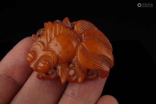 A Chinese Butterscotch Amber Fish Plaque,