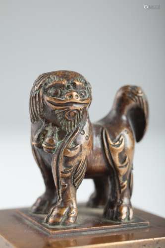 A Buddhist lion bronze scroll weight,