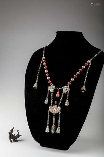 A Chinese silver necklace with qilin pendant,