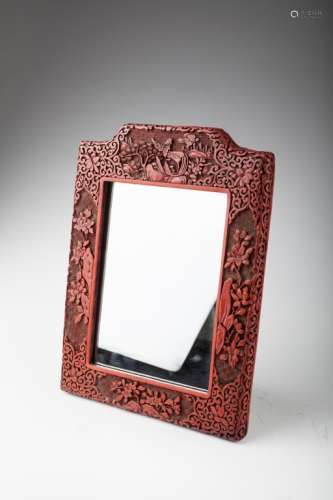 A Chinese carved cinnabar lacquer table mirror,