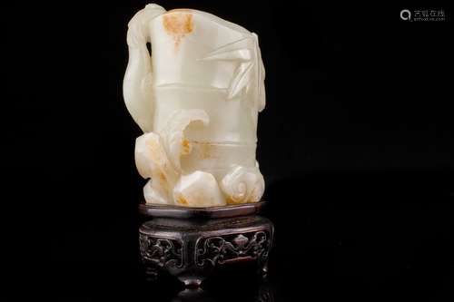 An old Chinese jade carving with stand,