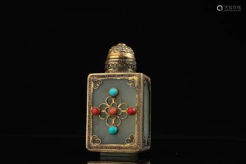 A Chinese silver mounted jade snuff bottle,