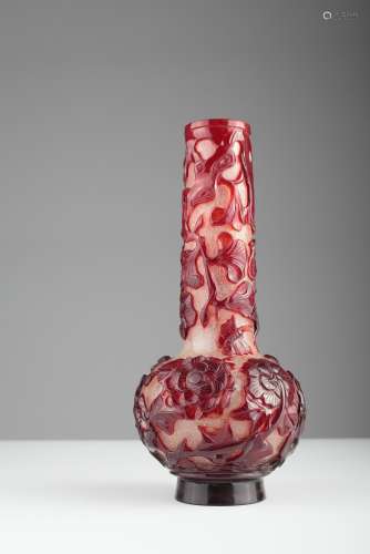 A Chinese Peking ruby color carved glass vase,