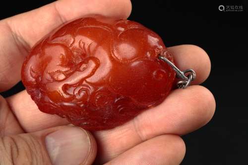 A Chinese butterscotch carved amber plaque,