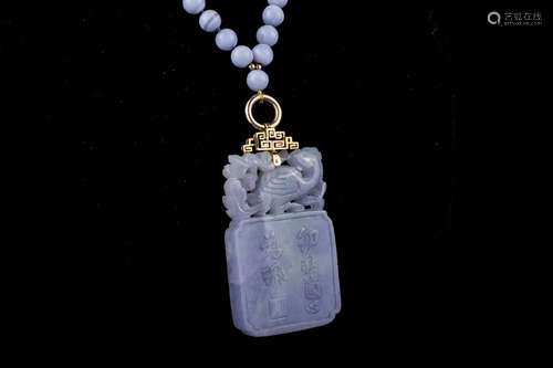 An old Lavender jade pendant with gold bale,