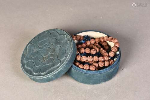 A STRAND OF OFFICIAL NUTS BEADS IN FABRIC BOX, QING DYNASTY