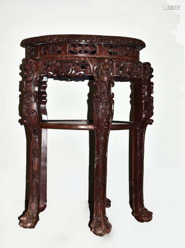 A CHINESE CARVED HARDWOOD MARBLE TOP TABLE