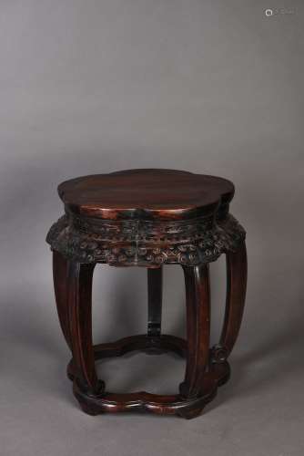 A PETAL-LOBED SHAPED HARDWOOD STOOL