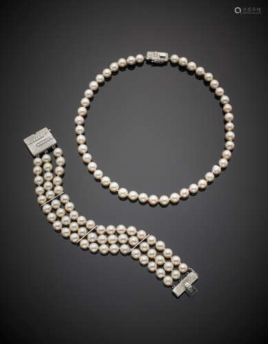 White pink-hued cultured pearl set composed by a necklace and a three strand bracelet each with white gold diamond clasp, in all g 72.60. Necklace length cm 39 bracelet cm 18.5