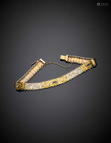 Bi-coloured gold chiselled modular bracelet with three light-blue gemstones,  g 12.83, length  cm 19.50.(defects)
