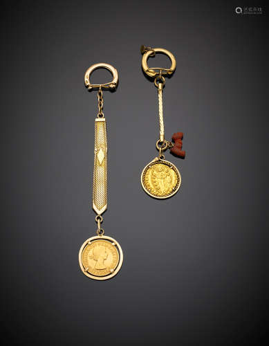 Two yellow gold key ring, the first a pound the second with an older coin, in all g 35.48.