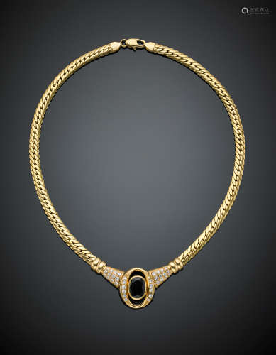 Yellow gold necklace with a central diamond accented oval sapphire, g 28.30, length cm 40 circa.